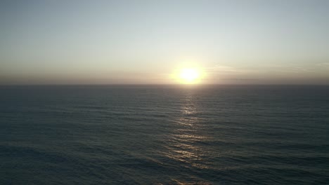flying into the sunset over the sea in portugal