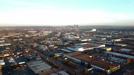 Flying-over-warehouses-in-busy-industrial-zone-in-Calgary,-Alberta