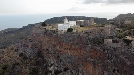 orbital cinematic view over castle of chora cliff, kythira island, greece