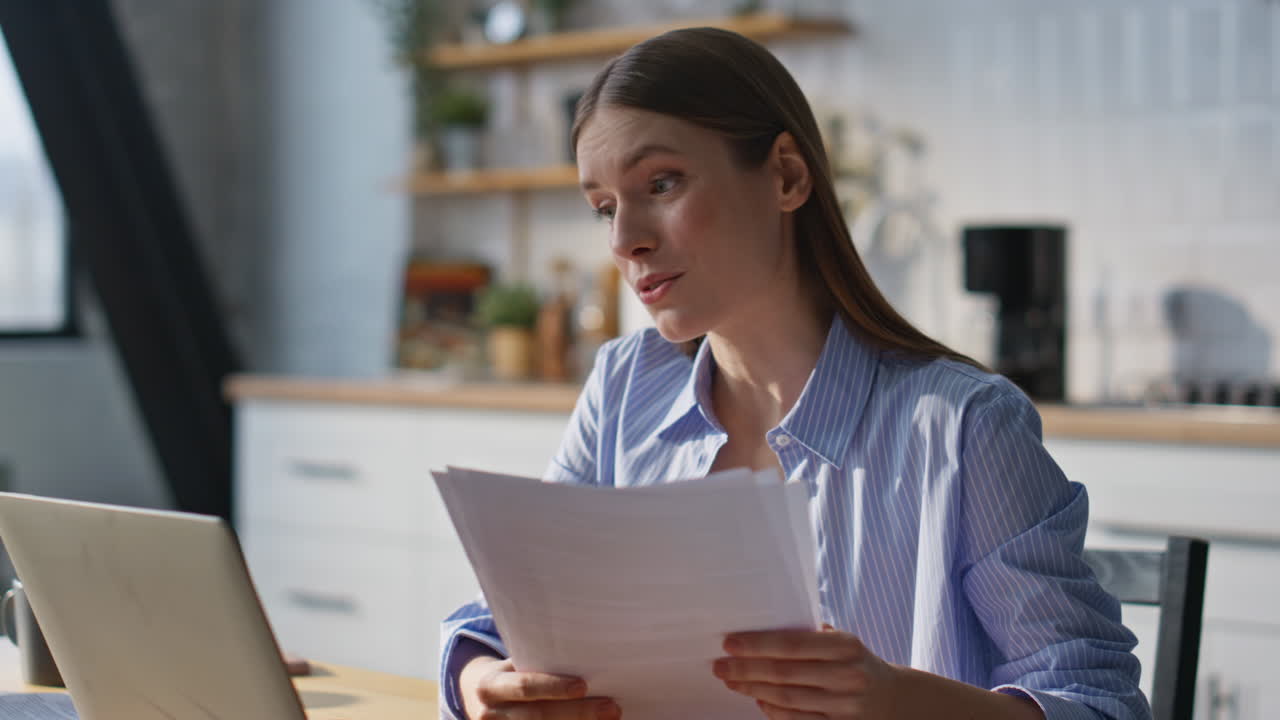 Business coach talking video meeting by laptop sitting home kitchen closeup