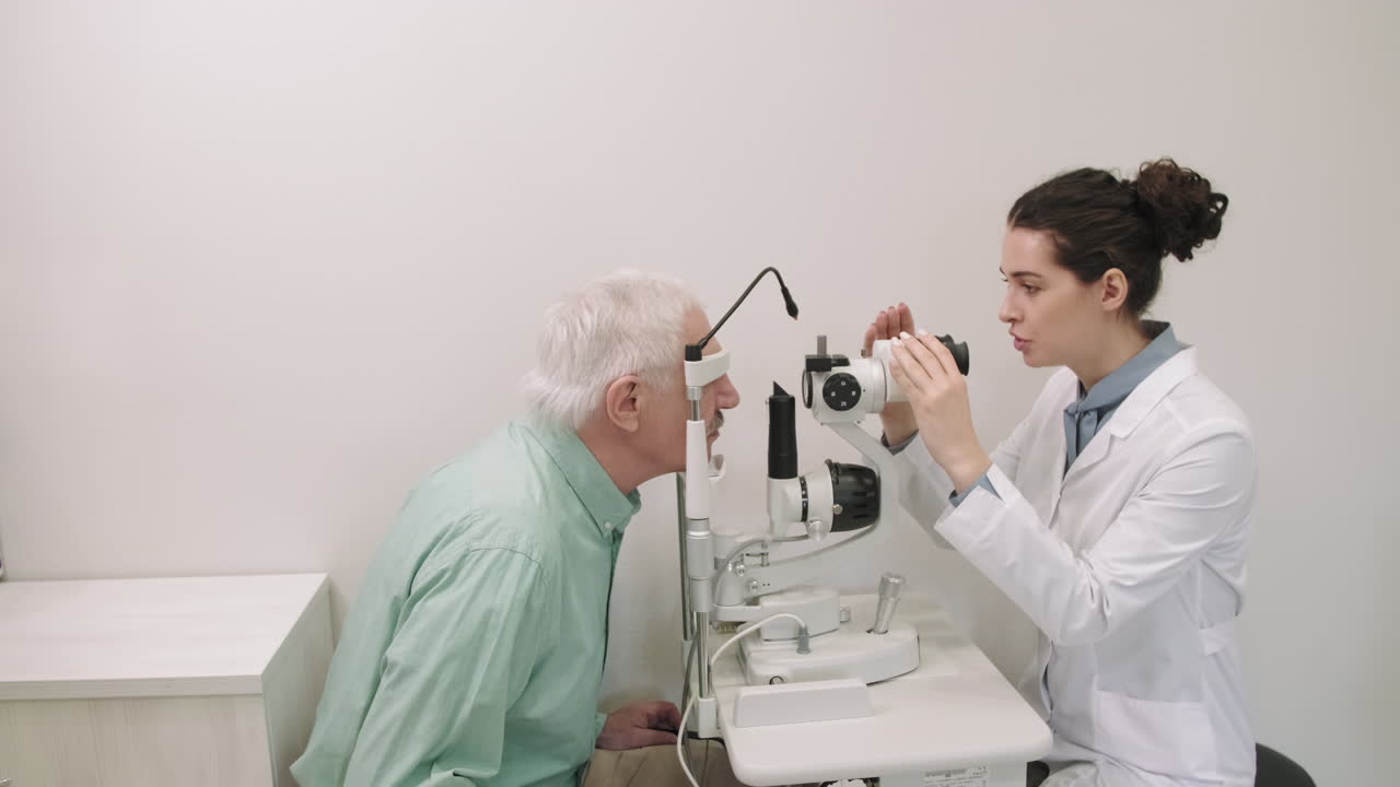 Senior Man Doing Eye Checkup In Modern Clinic