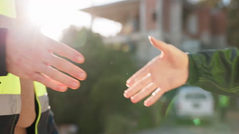 construction worker, shaking hands