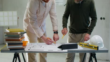 architects reviewing construction plans