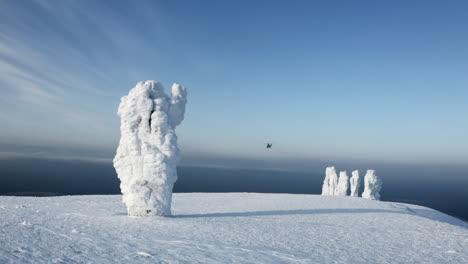 icy mountain peaks with helicopter