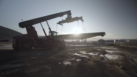 Wide-angles-shot-of-a-lifting-truck-moving-a-big-steel-beam