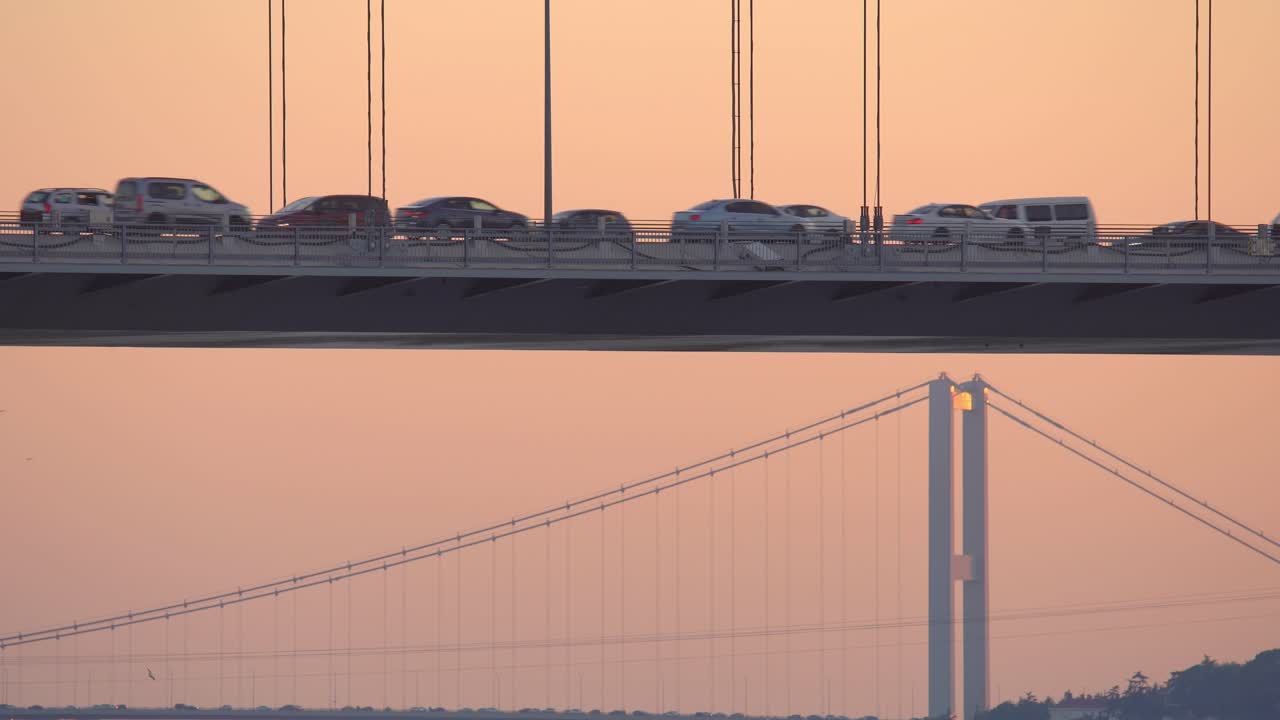Closeup view of Fatih Sultan Mehmet bridge with Bosphorus Bridge view in the background at sunset
