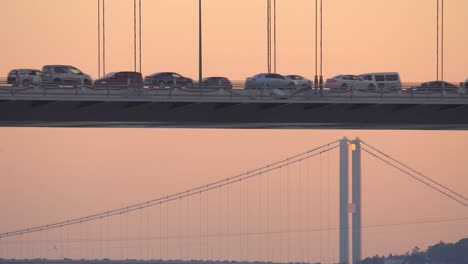 closeup view of fatih sultan mehmet bridge with bosphorus bridge view in the background at sunset