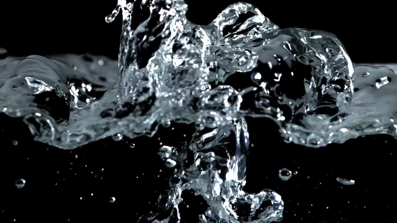 Close-up of Clear Water Splashing and Bubbling on Black Background