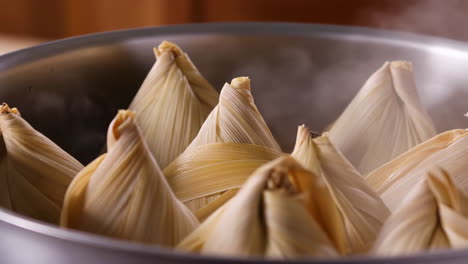 traditional wrapped food steaming in corn husks