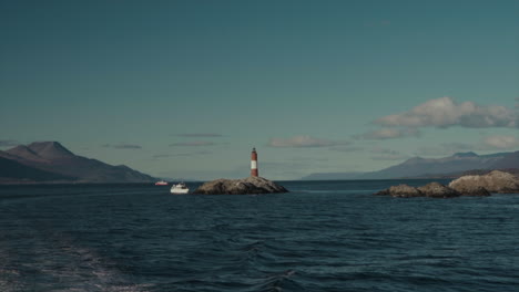 lighthouse in the middle of the ocean