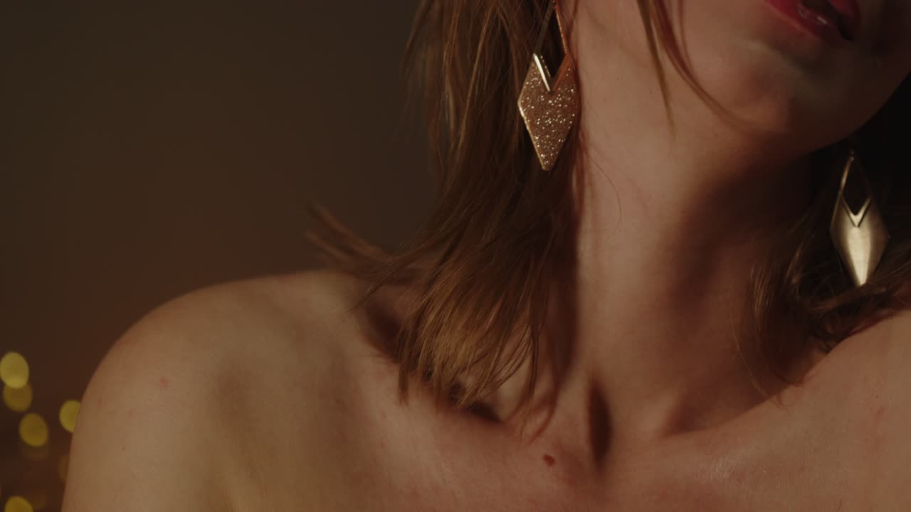 Tilt up of the beautiful body of an enticing woman smiling in slow motion