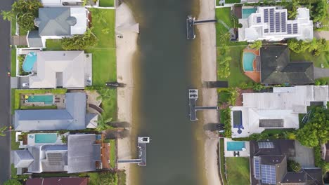 houses and pools along a waterway