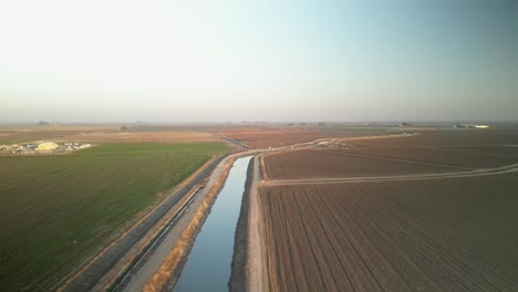 Lake Tulare’s surroundings unfold in drone footage, showcasing irrigation systems, vast open fields, and a patchwork of agricultural activity.