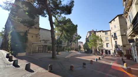 empty square with a tree in montpellier sunny day lockdown period france