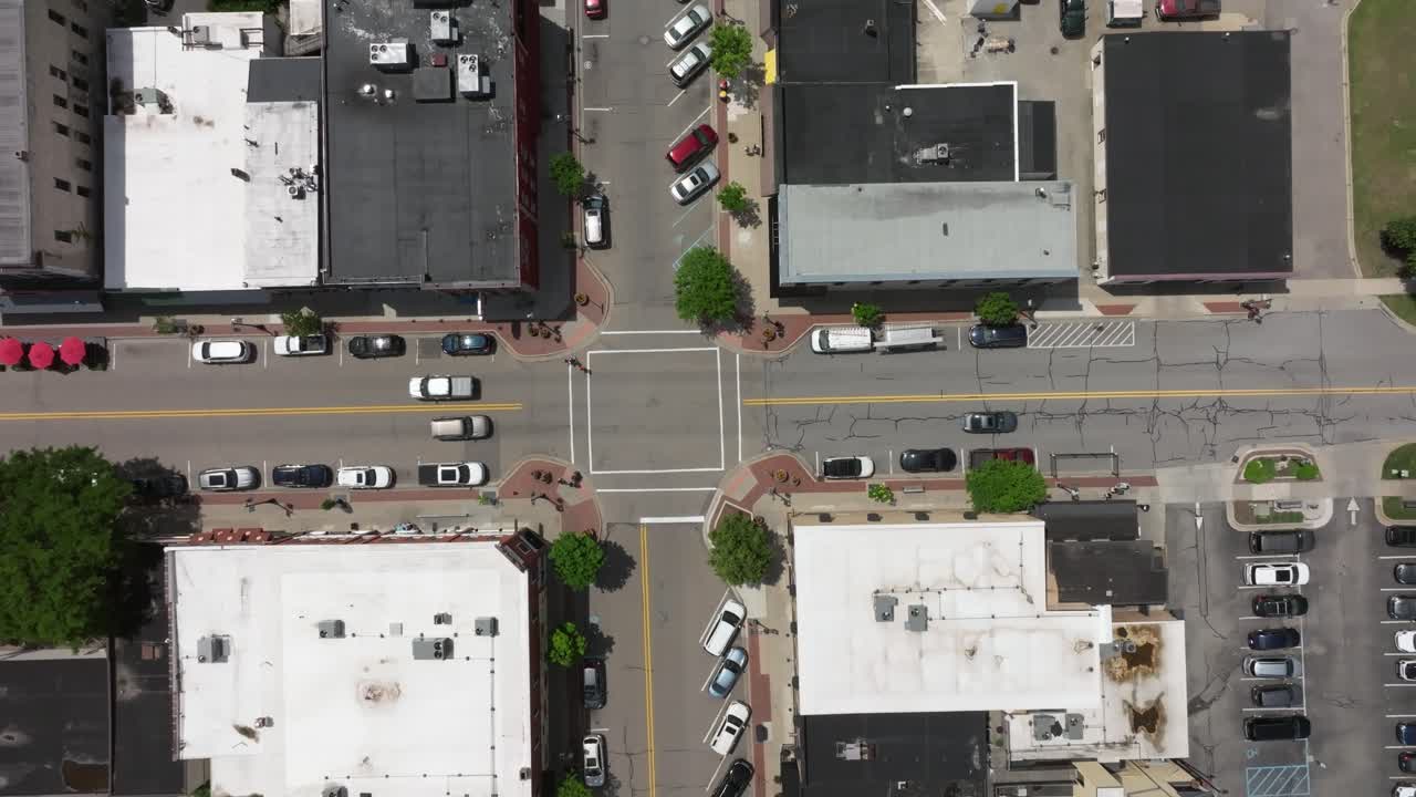Downtown Rockford, Michigan intersection with drone video overhead looking down stable
