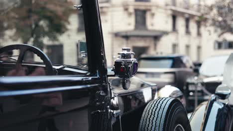 vintage black car on city street