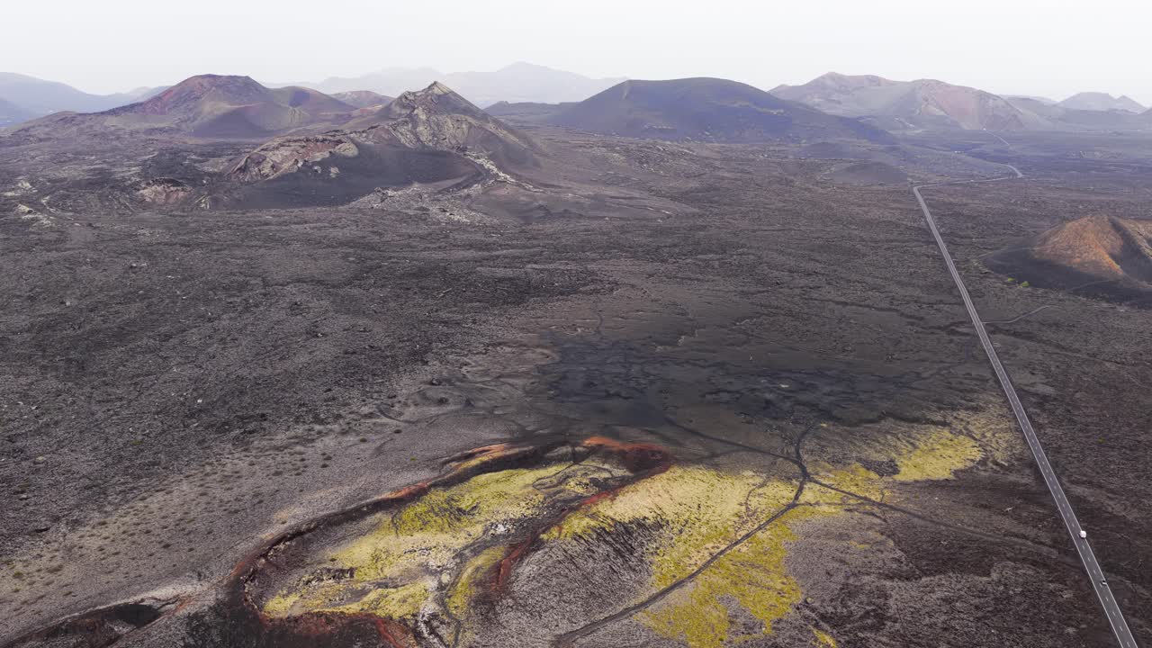 Timanfaya National Park In Lanzarote, Spain - Expansive Volcanic Plain With Dark Lava Fields And Rugged Craters. aerial shot