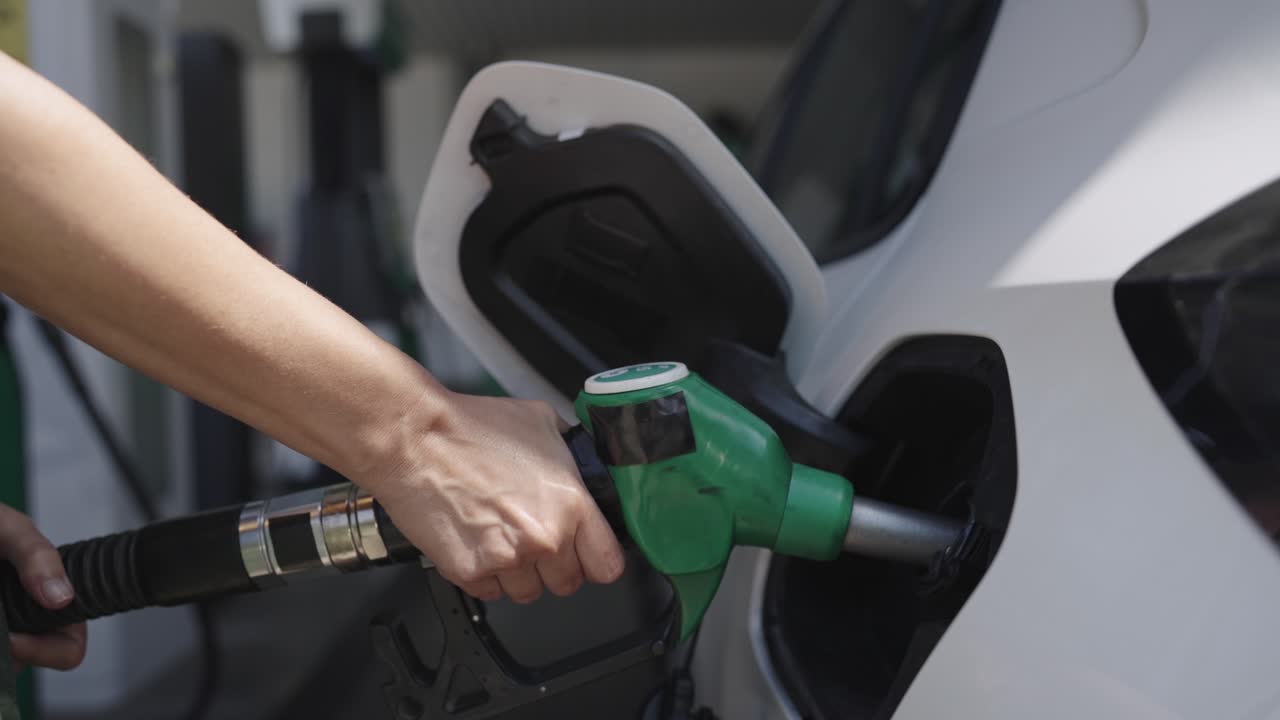 Refueling a car at a gas station