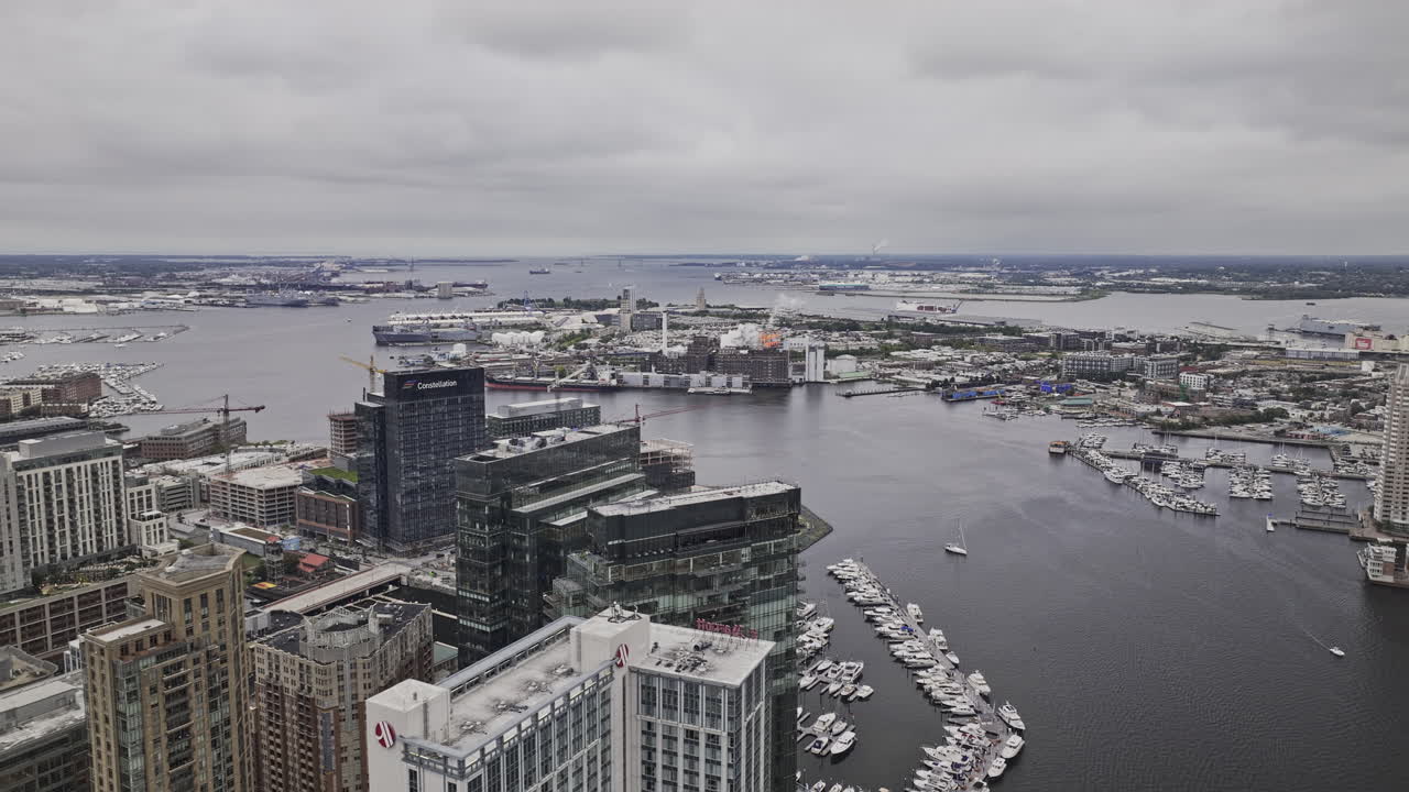 Baltimore Maryland Aerial v83 flyover Harbor East capturing waterfront development, marina and views of Locust Point across Patapsco river on overcast day - Shot with Mavic 3 Pro Cine - Sept 28th 2023