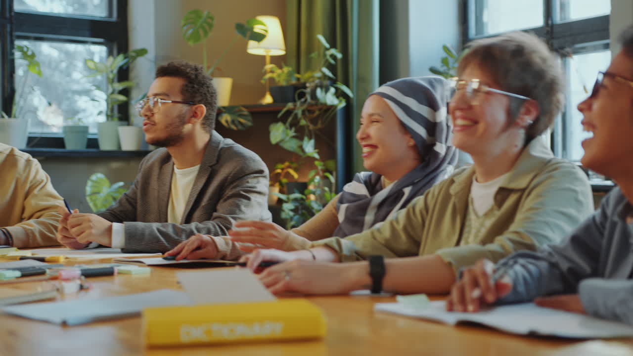 Joyous Immigrant Students Chatting and Laughing in Classroom