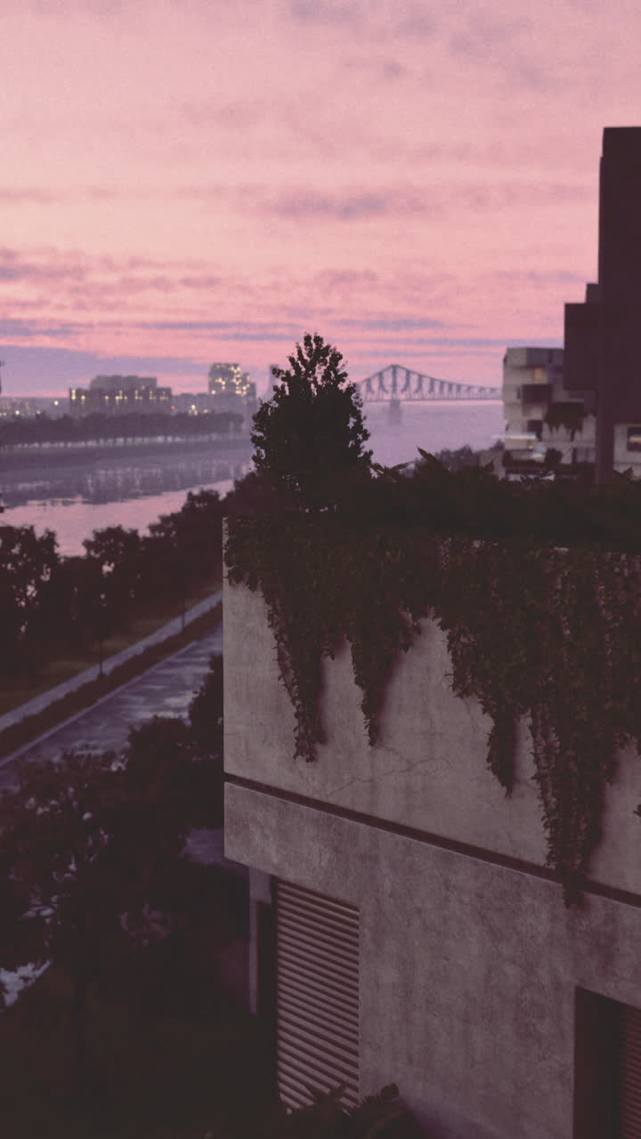 Colorful sunset reflecting on a river with modern buildings in the background