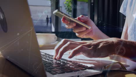 animation of connections over hands of caucasian man using laptop and smartphone