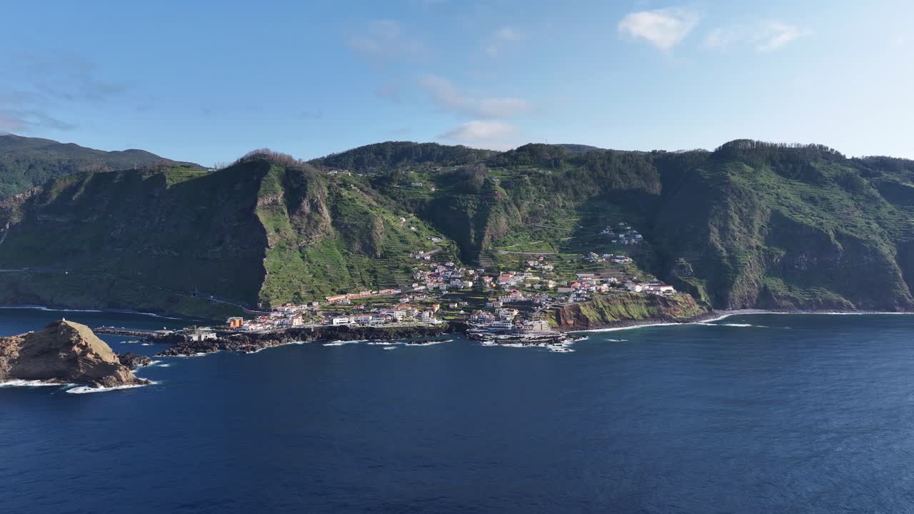 Drone approach toward Porto Moniz and Mole Island on mountainous Madeira