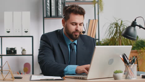 businessman working on laptop wearing headset call center support service operator office helpline