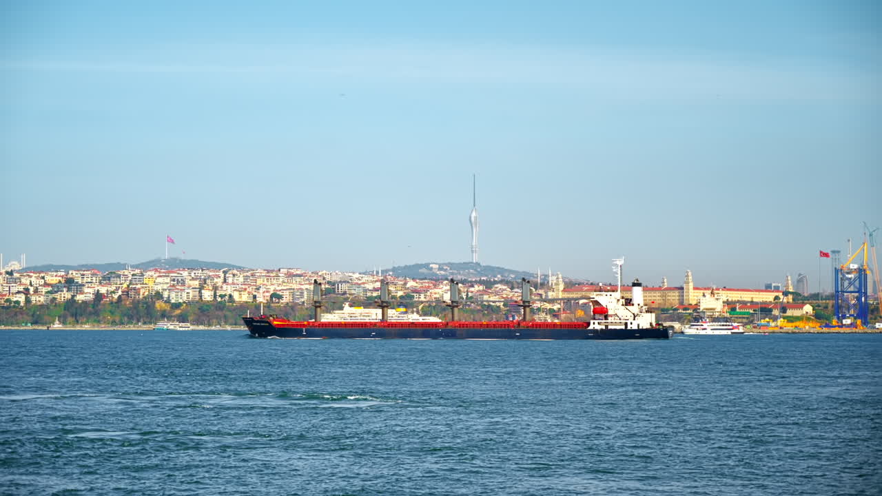 View of Bosporus strait in Istanbul, Turkey. Floating ship, cityscape on the background