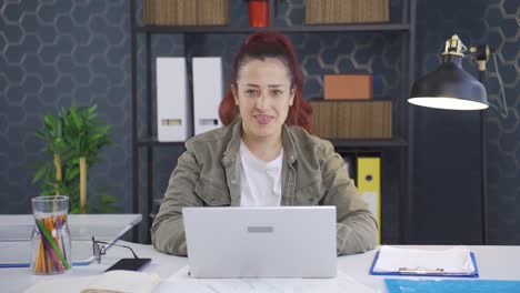 Business-woman-winking-at-camera.