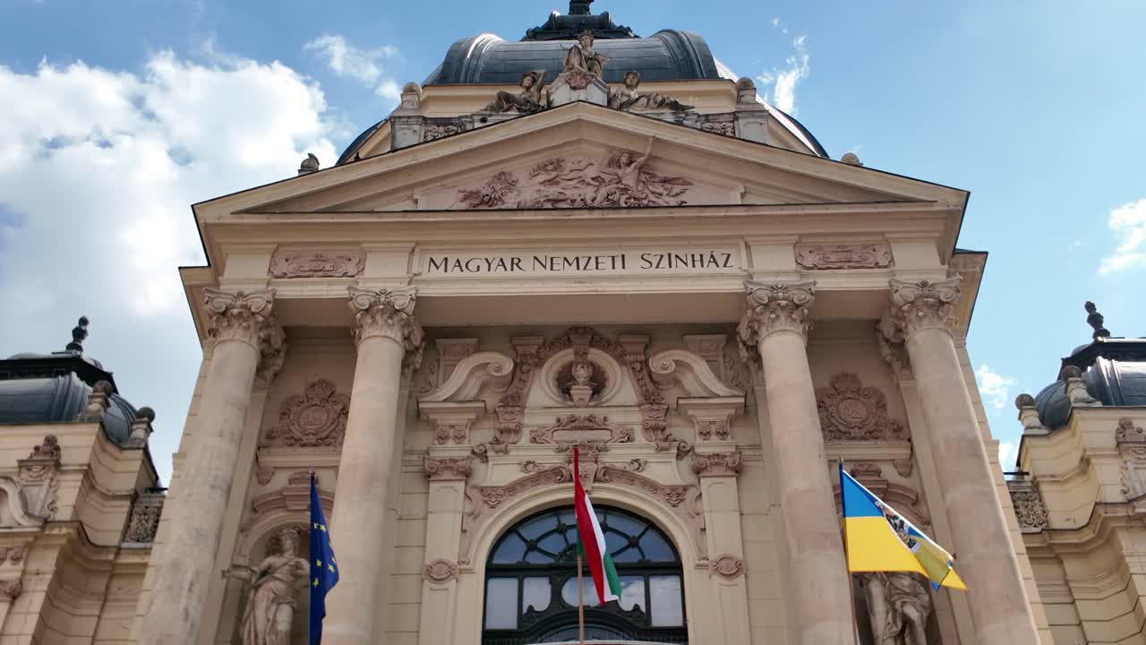 Scenic view emphasizing the historic facade of the National Theatre of Pécs, showcasing its European architectural style
