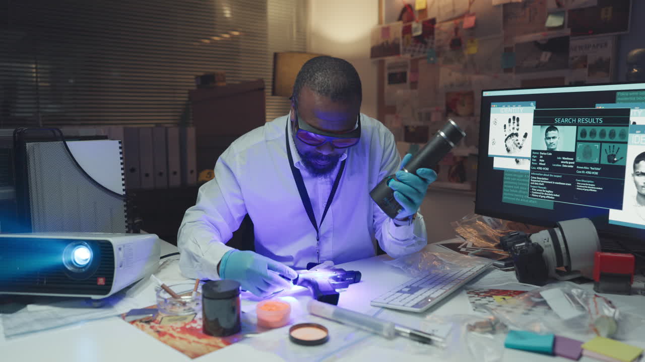 Forensic Scientist Examining Evidence with UV Light