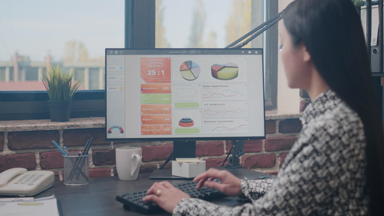 Entrepreneur designing business charts on computer
