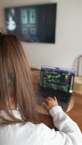 woman working on laptop at home