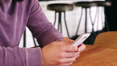 Smiling-man-using-mobile-phone