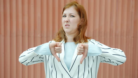 woman giving a thumbs down