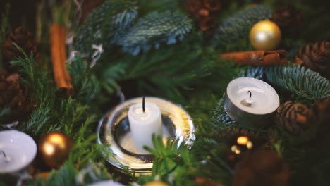 a burning candle was blown out of a christmas wreath