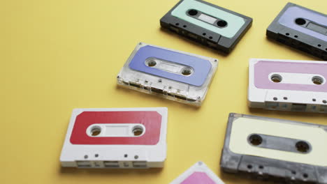 video of retro tapes with copy space on yellow background