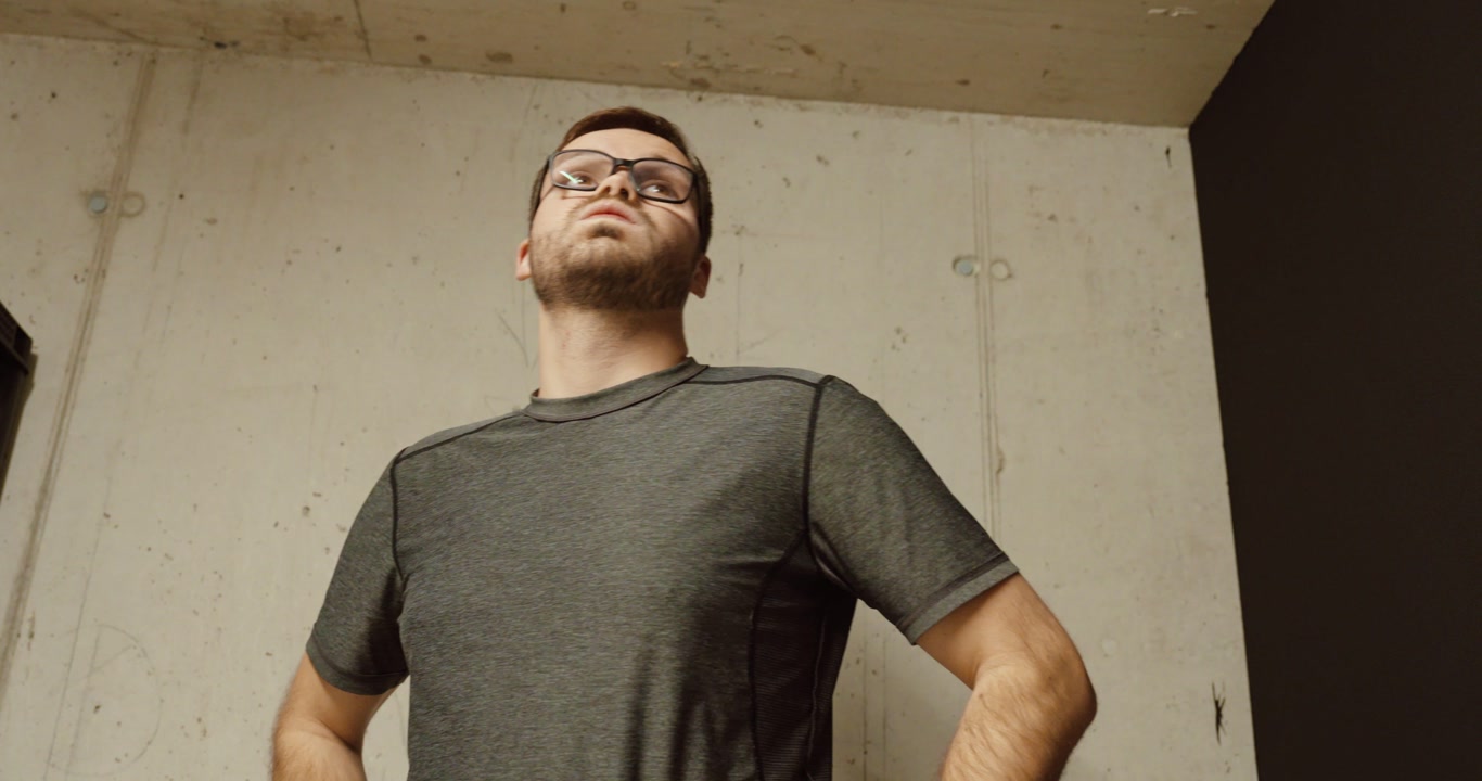 a worried man waiting inside a bunker shelter during a dangerous situation. Concept of war anxiety, civilian protection, emergency shelter, and stress during conflict.