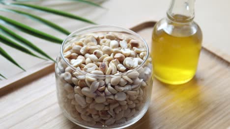 Overhead-shot-view-peanuts-and-oils-in-a-container-,