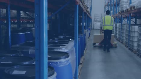 Animation-of-network-of-profile-icons-over-rear-view-of-a-male-worker-pushing-a-pallet-at-warehouse