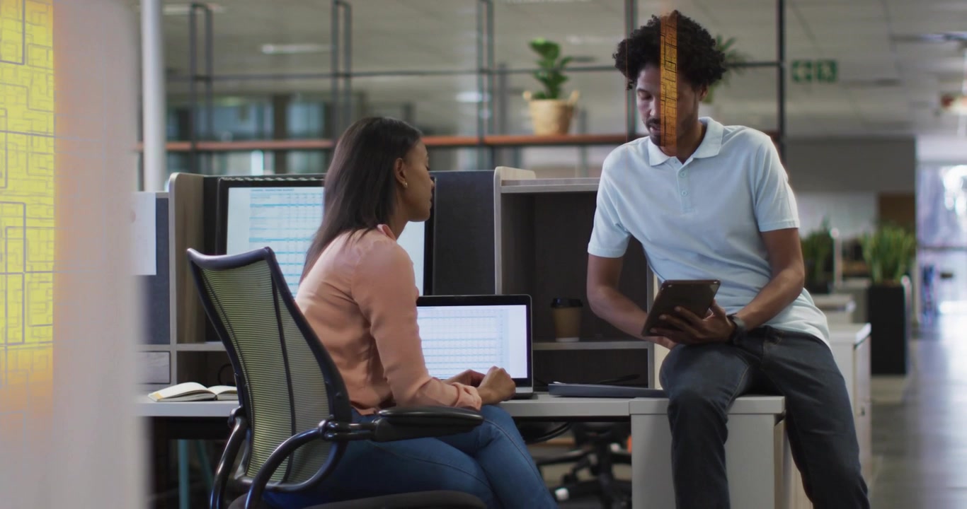 Woman pointing at laptop, man scrolling tablet, initiating business review as yellow bars sweeping