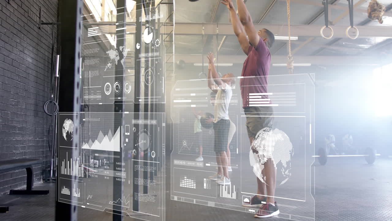 Exercising in gym, two people with digital animation data graphics overlay