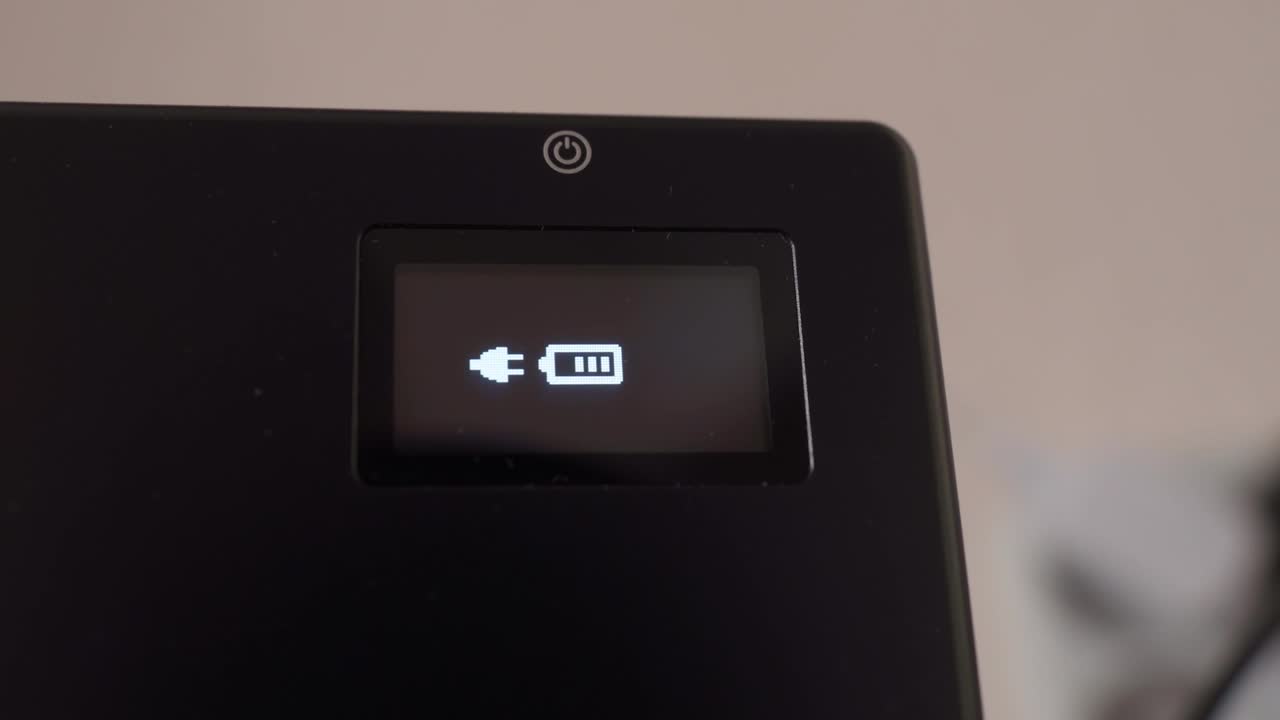 The process of charging the device, video light. Charging gadgets. Selective focus