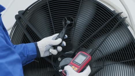 testing with an anemometer of an axial fan of the condensing unit