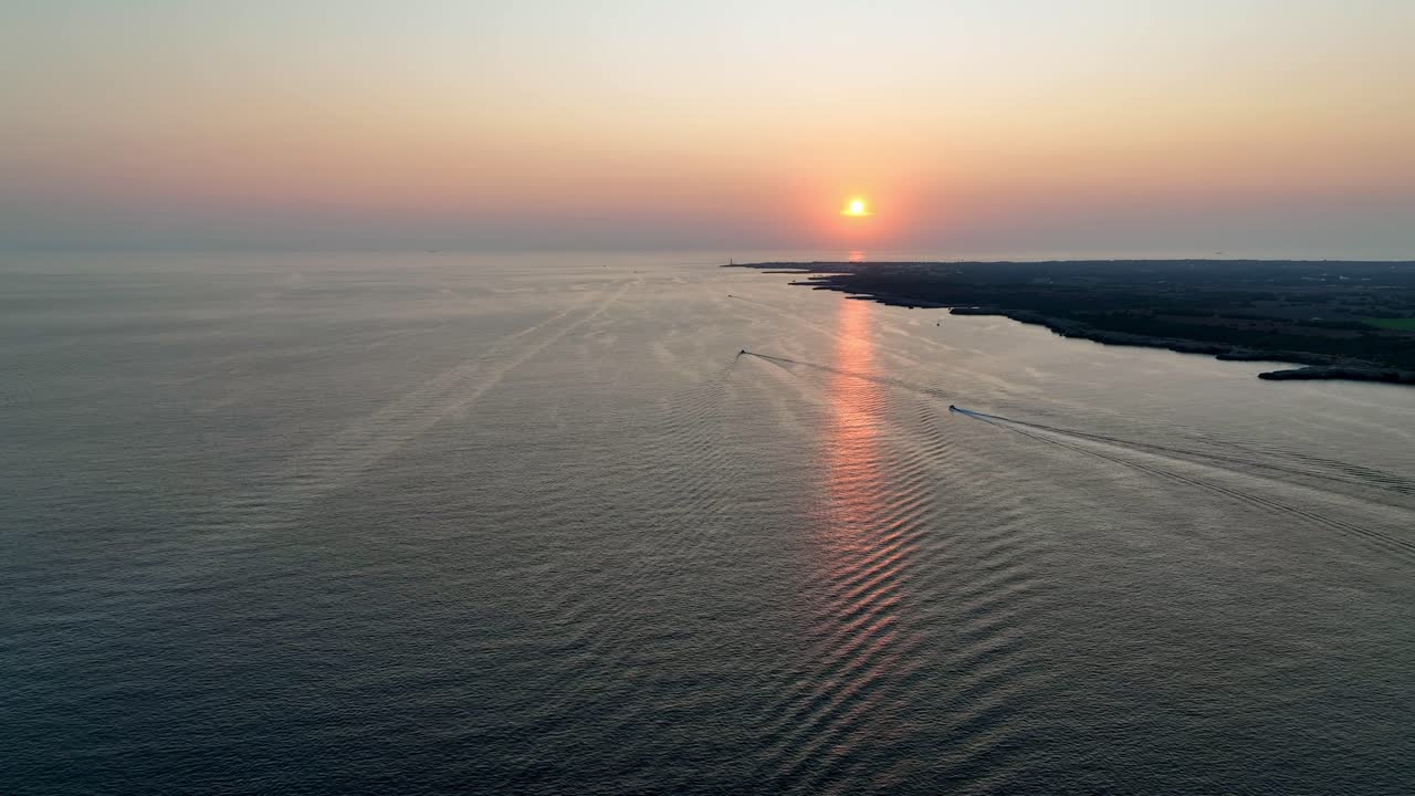 Sunset over the flat coast on Menorca.