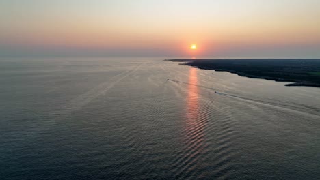 sunset over the flat coast on menorca.