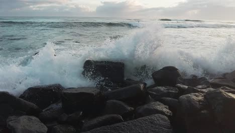 seascape waves crushing the rocks in coast, splashing water, slowmo