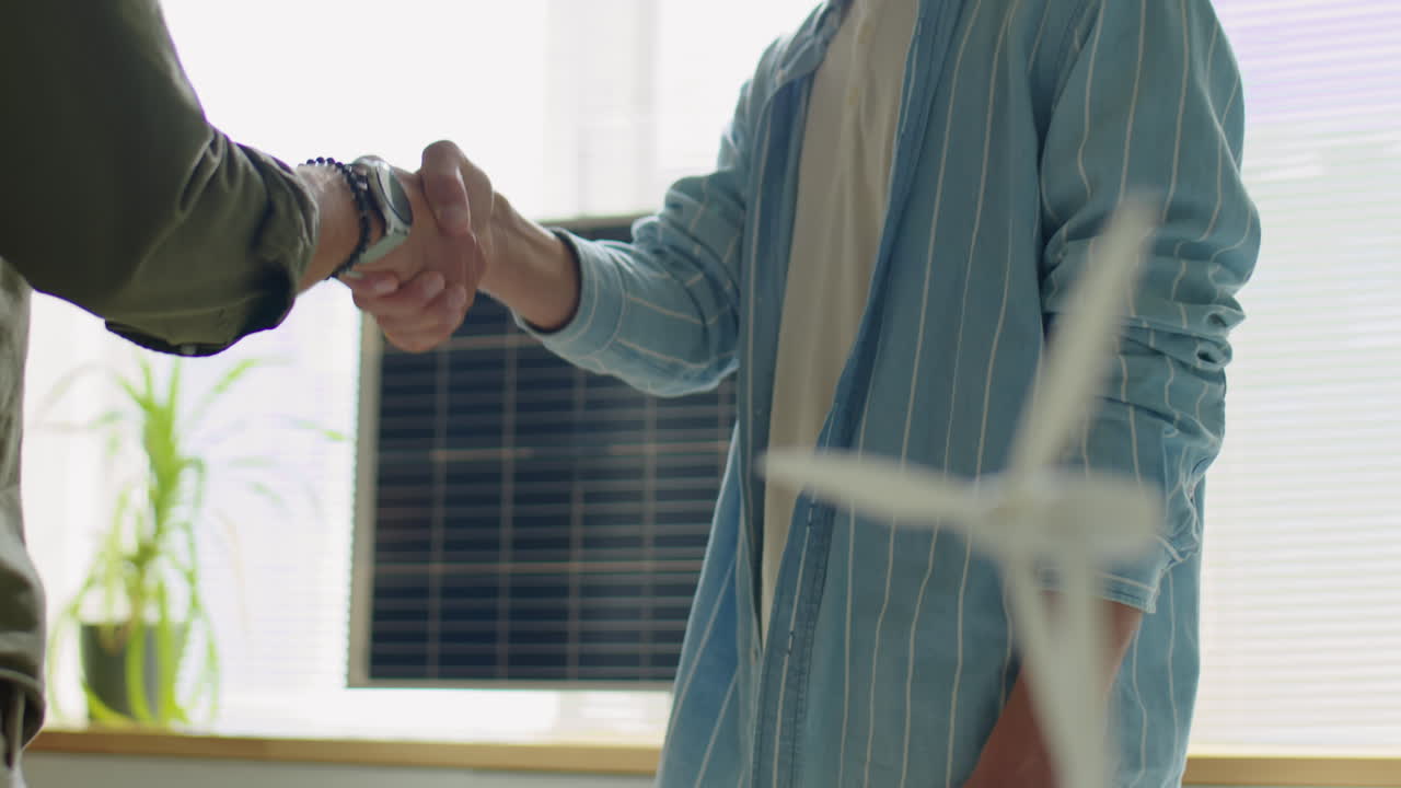 Handshake of Renewable Energy Developers in Office