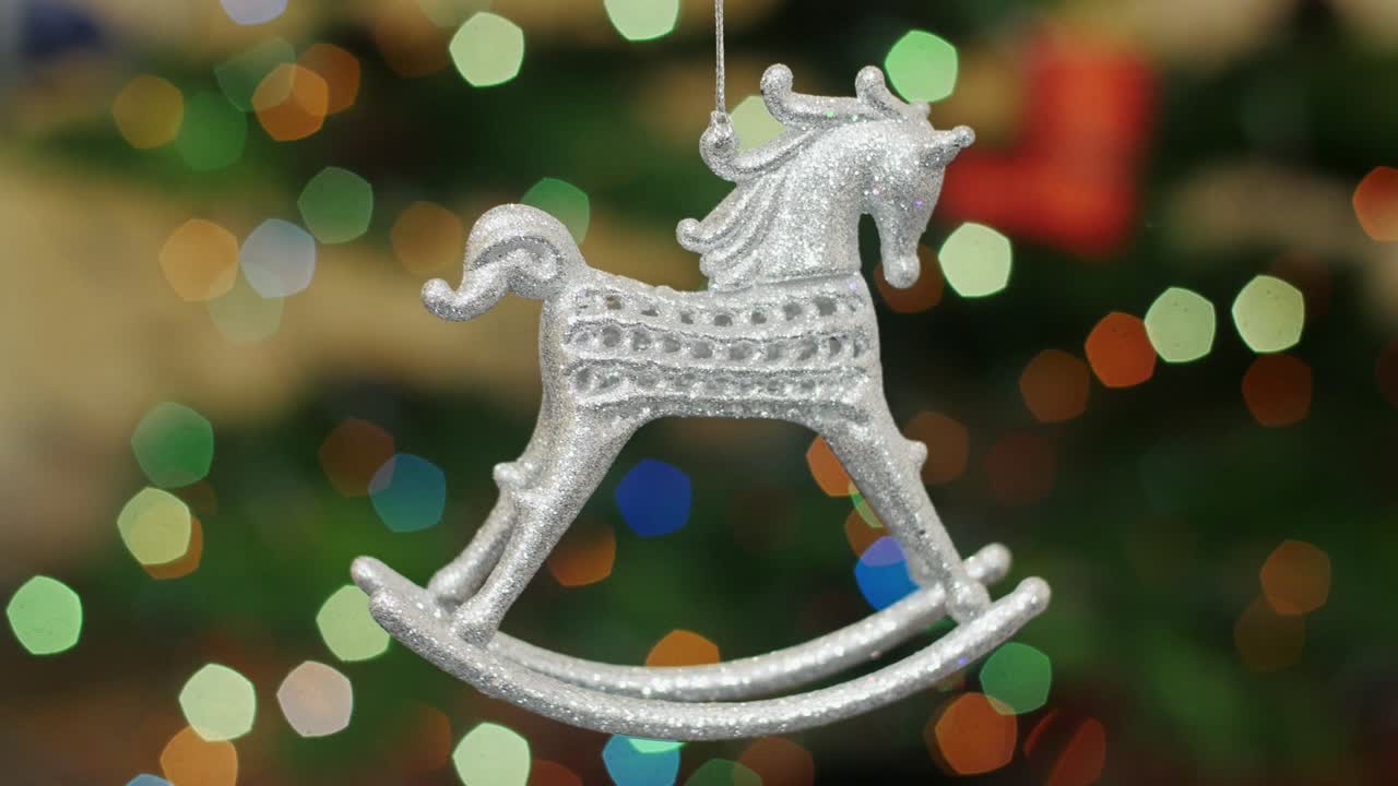 Christmas horse toy shakes at background bokeh